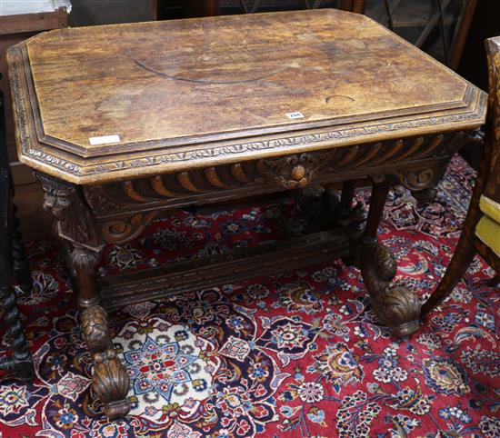 A late Victorian carved oak centre table, and a carved oak chair W.102cm